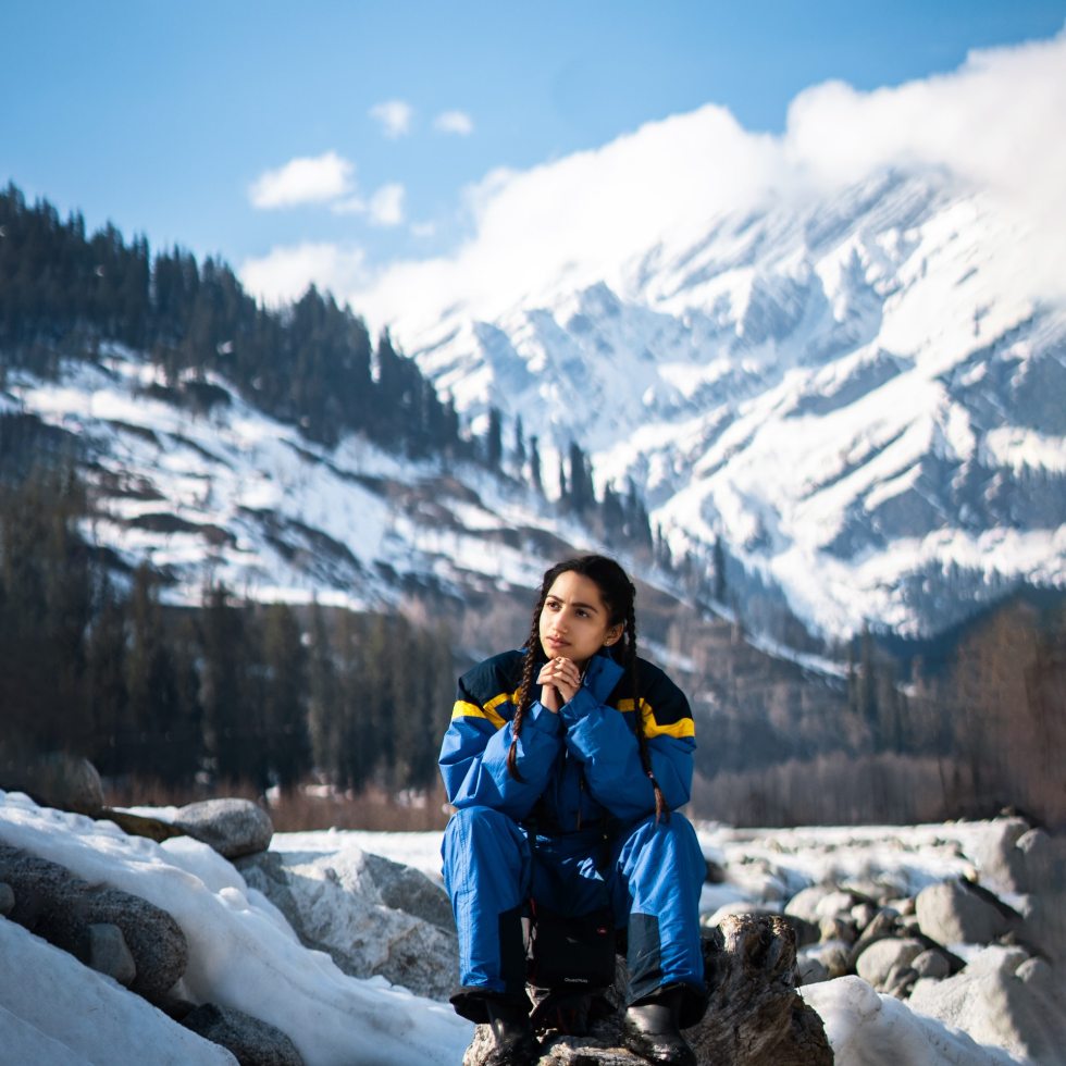 Girl Sitting On The Rock In Manali